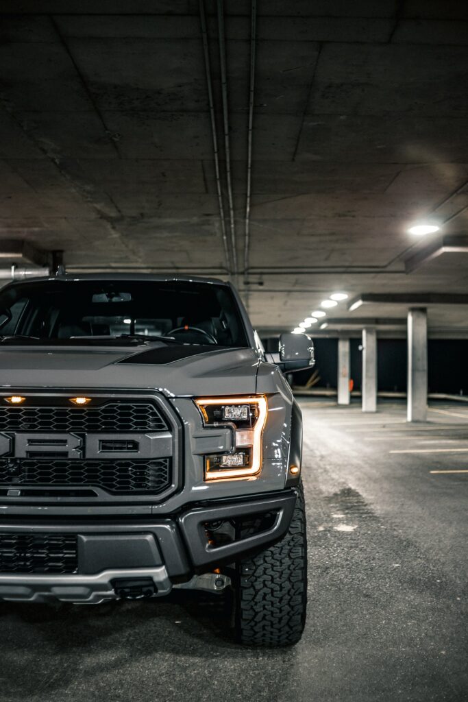 Powerful SUV Front View in Dimly Lit Garage | Adventure Wallpaper