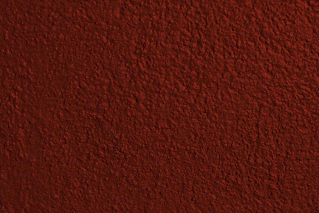 Bold Textured Red Wallpaper: Vibrant Dark Red Design Background