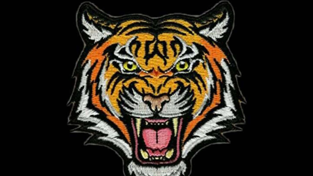 Bold Tiger Patch Wallpaper on Black: Striking Design & Colors