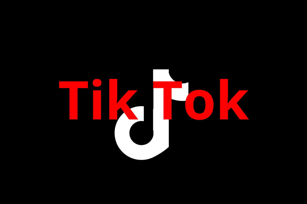 Bold TikTok logo wallpaper with white note and striking red text on black background for fans
