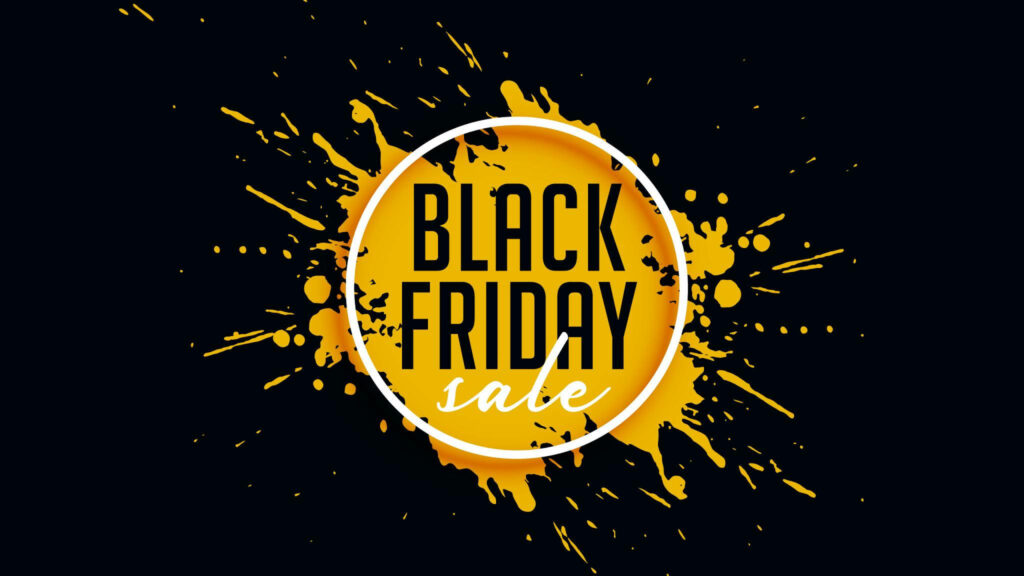 Bold yellow paint splatters with Black Friday sale text on dark background for promotions wallpaper