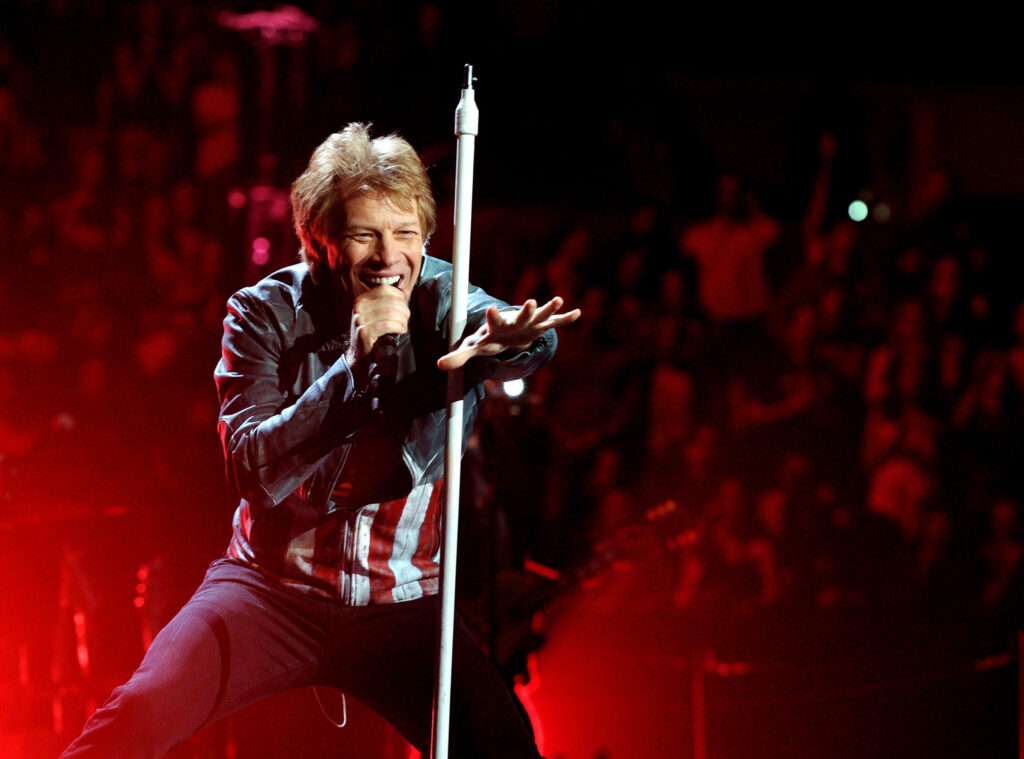 Bon Jovi live on stage red lighting dynamic energy Because We Can World Tour concert wallpaper background
