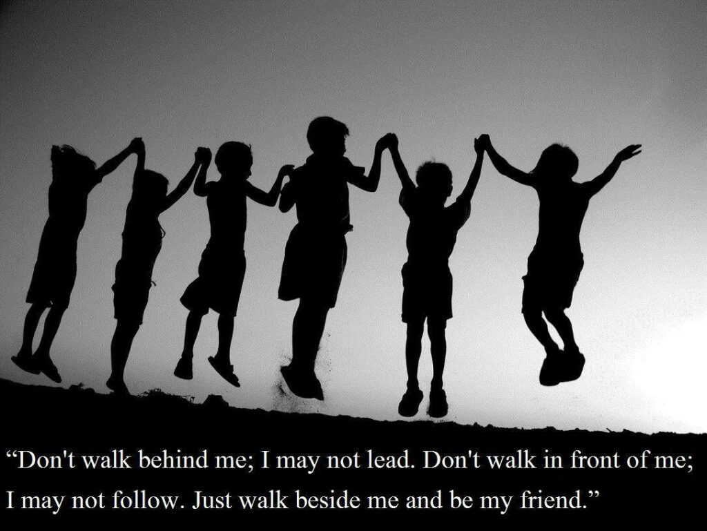 Unbreakable Bonds: A Captivating Silhouette of Six Kids Embracing Friendship with a Heartfelt Quote Wallpaper