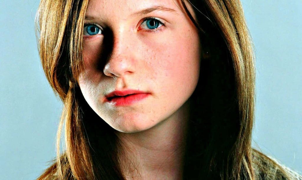 Bonnie Wright as Ginny Weasley intense gaze auburn hair blue eyes Harry Potter portrait wallpaper