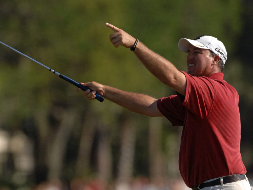 Boo Weekley mid swing on golf course vibrant greenery clear lighting focused expression wallpaper
