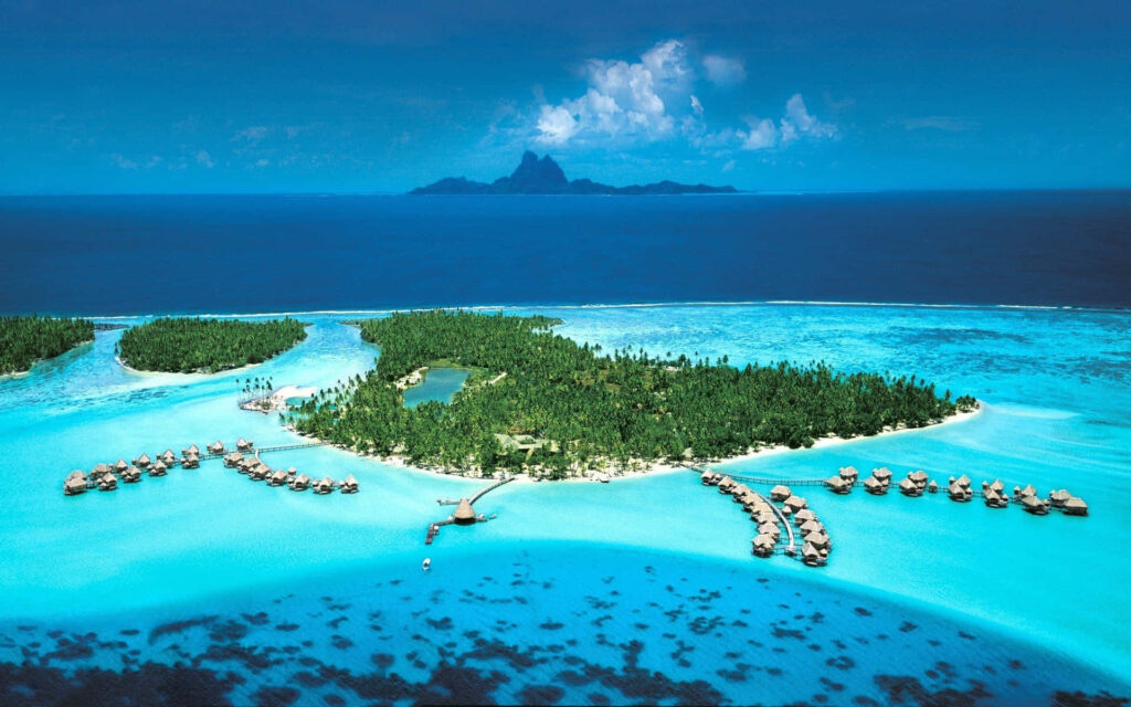 Bora Bora wallpaper with turquoise waters lush greenery and overwater bungalows vibrant blue sea