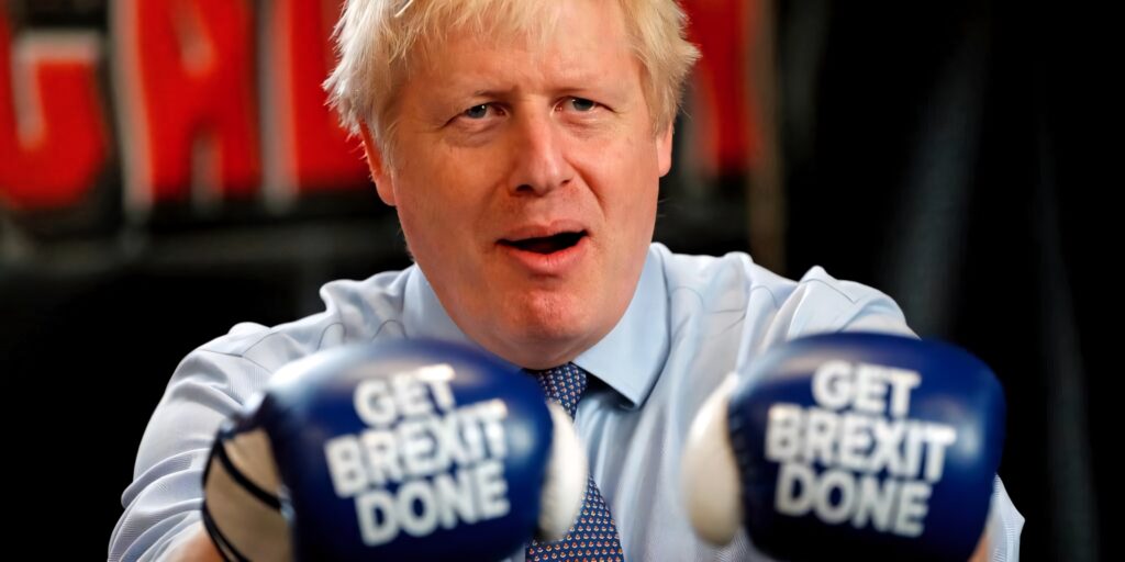 Boris Johnson wearing blue boxing gloves with Get Brexit Done slogan bold wallpaper background