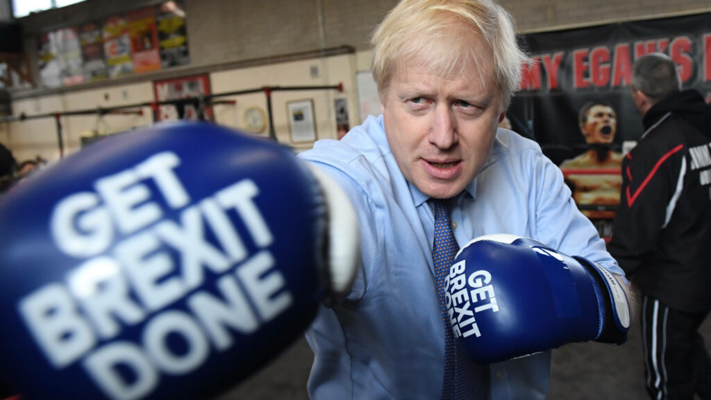 Boris Johnson in boxing gloves at gym with Get Brexit Done message dynamic political wallpaper