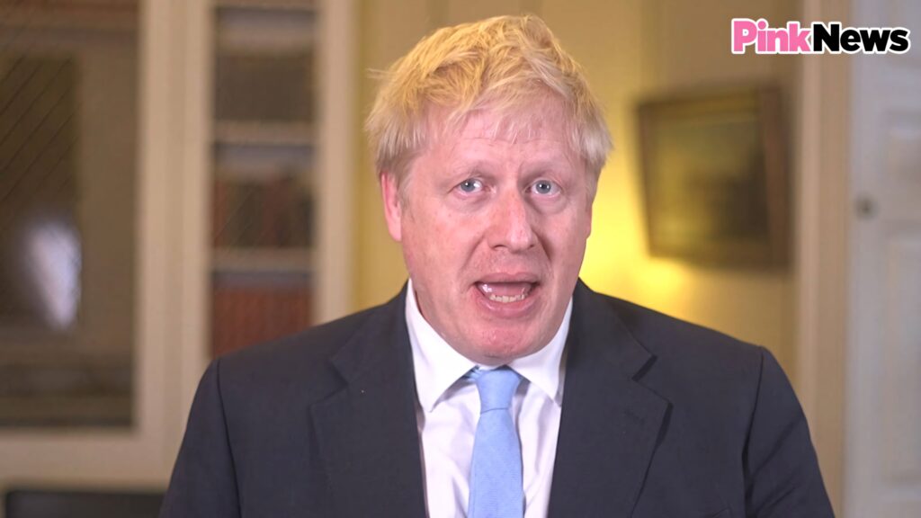 Boris Johnson in formal suit and light blue tie speaking indoors British politics wallpaper
