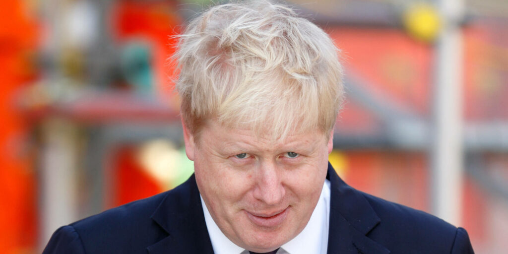 Boris Johnson smiling close-up portrait blonde hair suit vibrant background high-resolution wallpaper