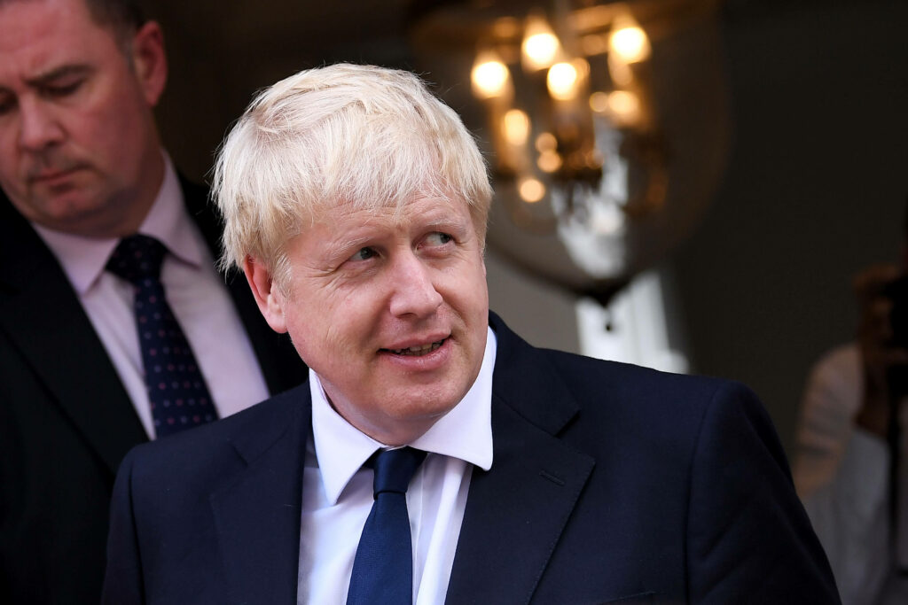 Boris Johnson portrait with white hair in dark suit and navy tie formal political wallpaper background