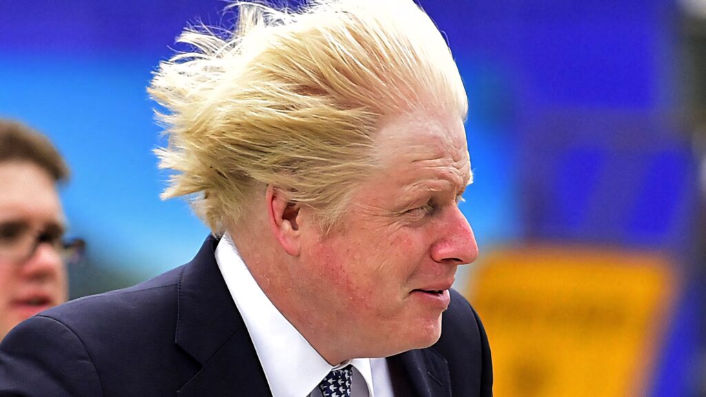 Boris Johnson Windy Hair Wallpaper High-Resolution Dynamic Outdoor Candid Portrait