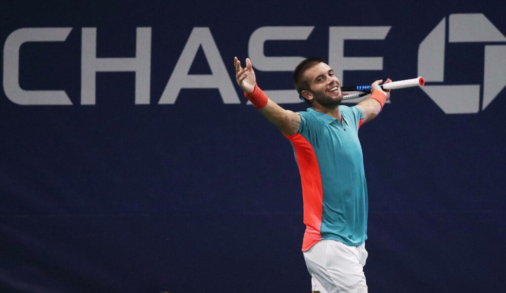 Borna Coric celebrating victory US Open 2020 tennis court CHASE branding dynamic energy wallpaper