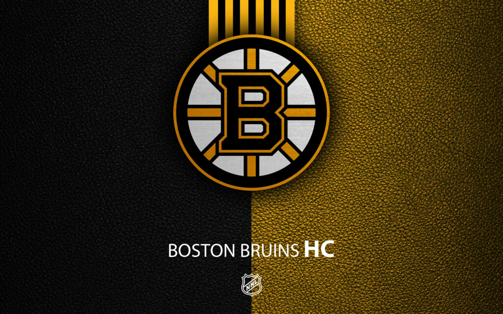 Boston Bruins logo on textured yellow and black split background bold hockey wallpaper