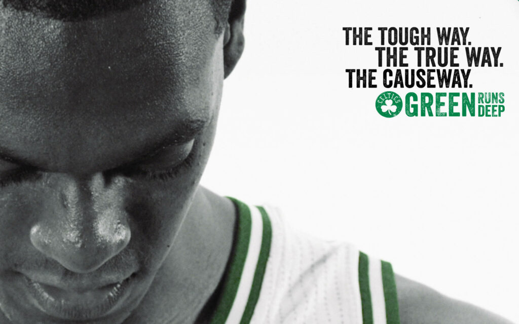 Boston Celtics Pierre Rondo close-up in green white jersey with motivational text and Celtics logo Wallpaper