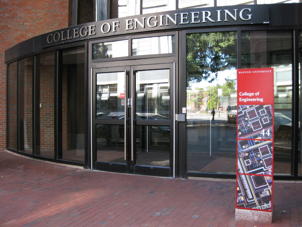 Boston University Engineering Building entrance with modern glass façade and brick walkway background Wallpaper