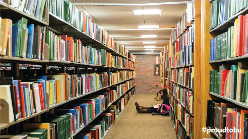 Boston University Library vibrant shelves colorful books student studying bright academic scene Wallpaper