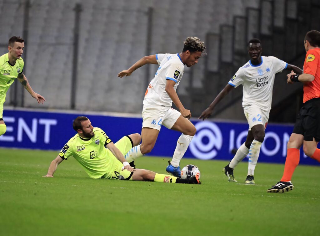 Boubacar Kamara defending the ball in action during intense football match high definition wallpaper