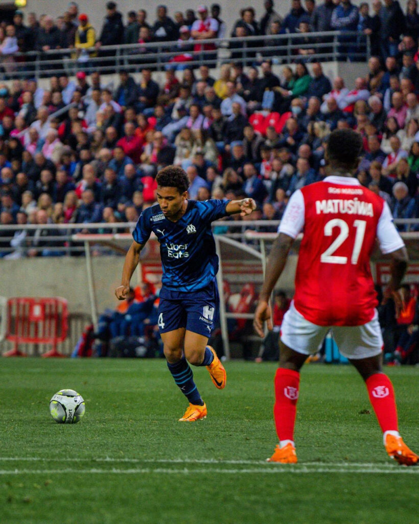 Boubacar Kamara controlling ball versus Matusiwa intense soccer match vibrant crowd wallpaper