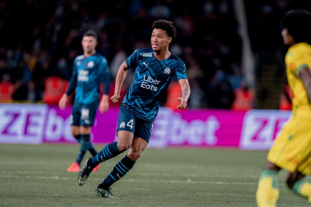 Boubacar Kamara in Olympique de Marseille blue kit number 4 focused in dynamic soccer action Wallpaper