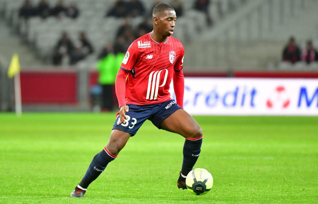 Boubakary Soumaré Lille OSC mid-game action in red navy kit high-resolution football wallpaper