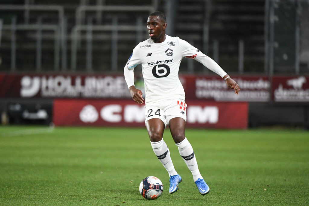 Boubakary Soumaré Lille OSC mid-match intense focus athletic movement stadium background wallpaper