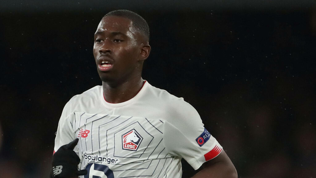 Boubakary Soumaré in Lille OSC kit mid-game showing focus athleticism and determination Wallpaper