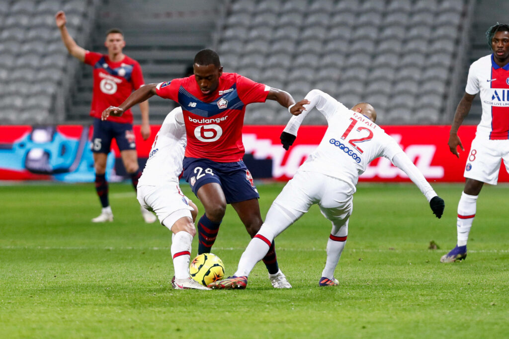 Dynamic Boubakary Soumaré evades defenders in vibrant football action wallpaper high-definition