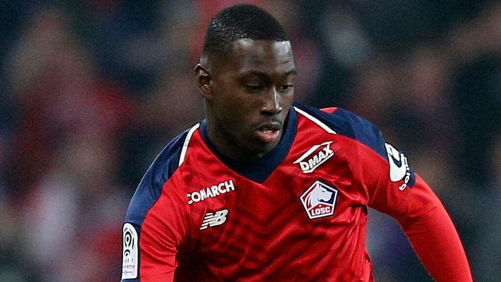 Boubakary Soumaré LOSC Lille dynamic wallpaper vibrant red blue focused football action