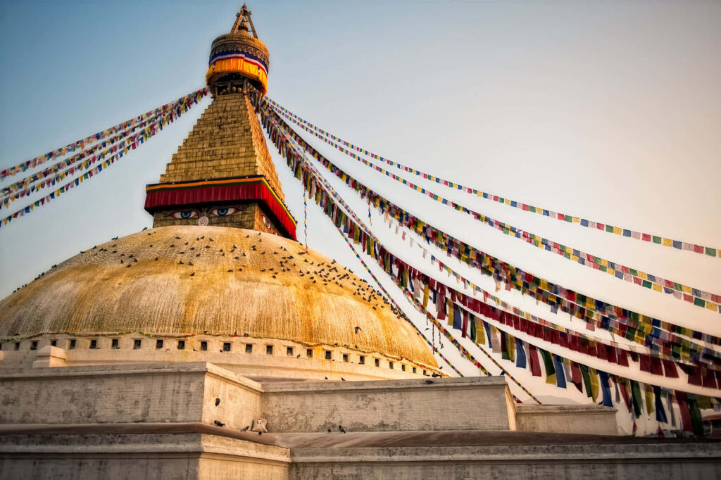 Boudhanath Stupa Kathmandu vibrant wallpaper with white dome golden spire Buddha eyes prayer flags