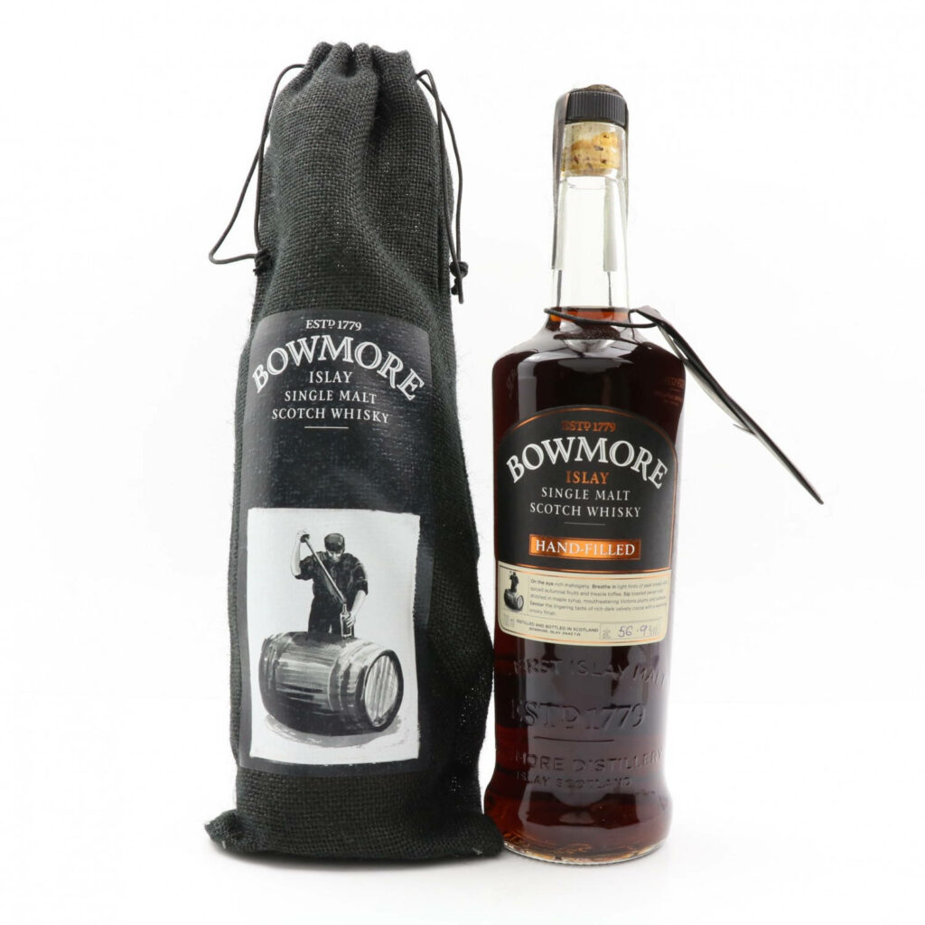 Bowmore Islay Single Malt Scotch Whisky bottle with black branded bag and barrel design wallpaper