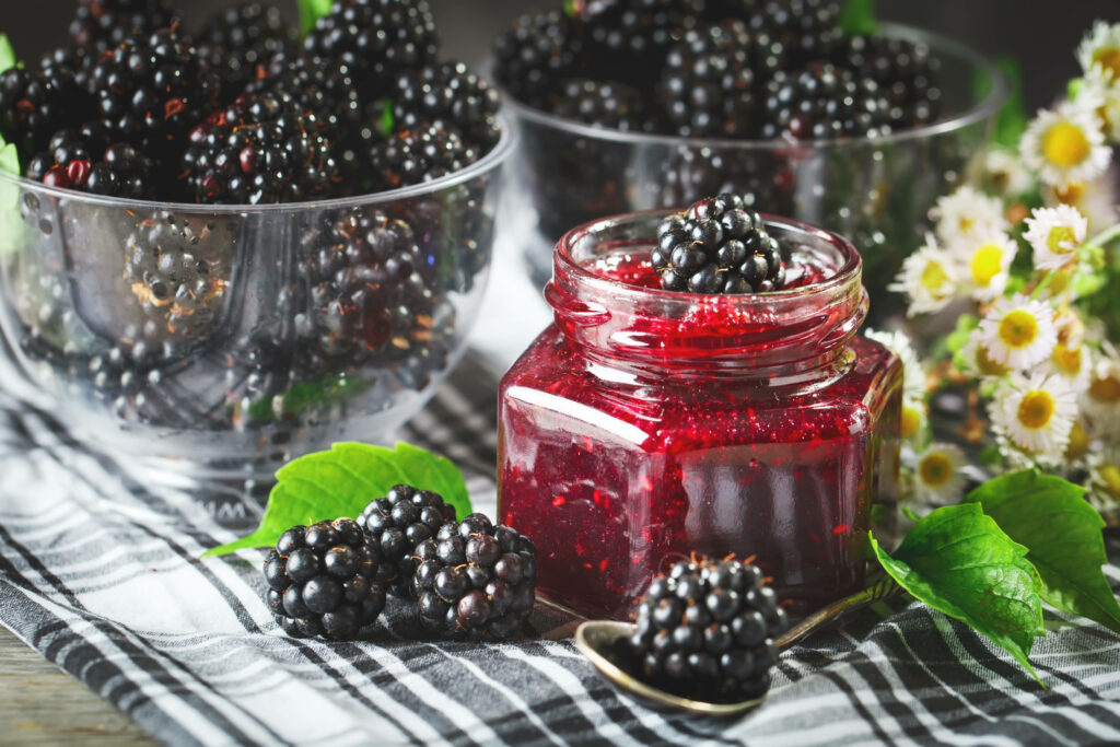 Farmhouse boysenberry centerpiece with fresh berries jam green leaves white daisies wallpaper