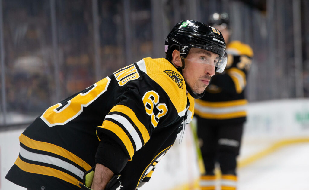 Brad Marchand Boston Bruins intense focus black gold jersey NHL hockey player wallpaper background