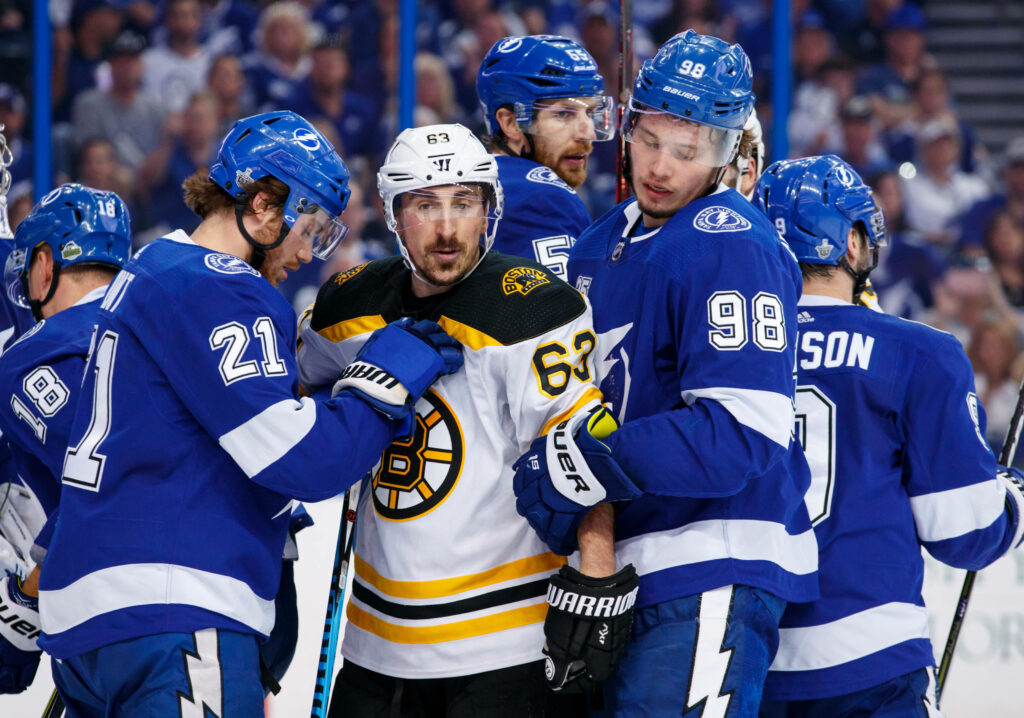 Brad Marchand Boston Bruins vs Tampa Bay Lightning intense NHL game vibrant arena wallpaper