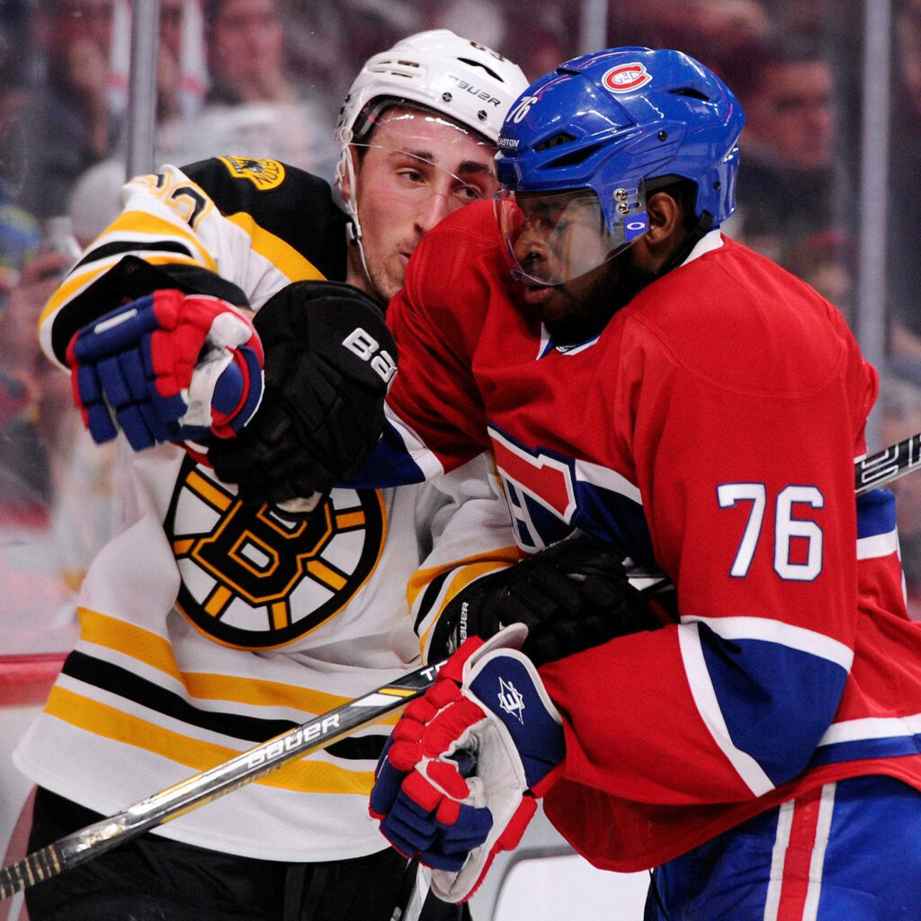 Brad Marchand Boston Bruins and P K Subban Montreal Canadiens intense NHL hockey face-off action Wallpaper