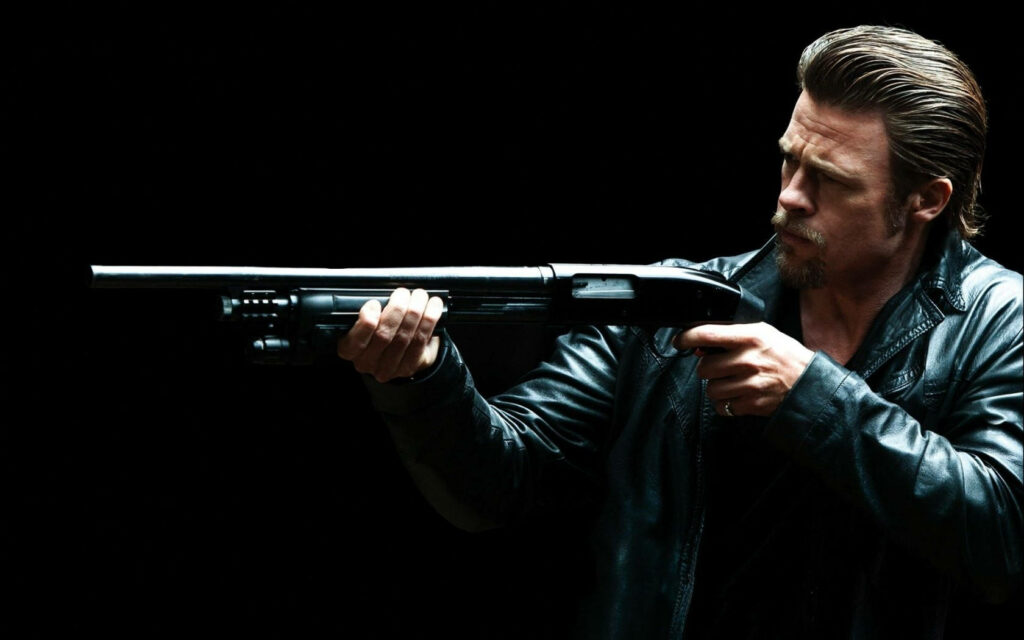 Brad Pitt in black leather jacket aiming shotgun gritty Killing Them Softly movie wallpaper background