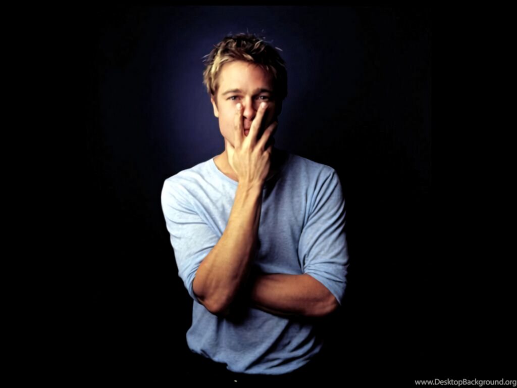 Brad Pitt serious expression hand covering face dark background striking wallpaper image