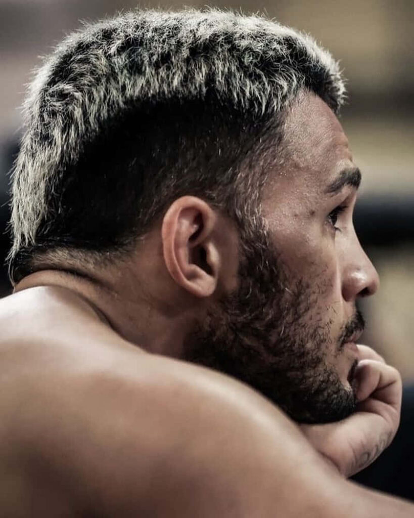 Side profile Brad Tavares UFC fighter wallpaper with blonde hair detailed skin realistic background