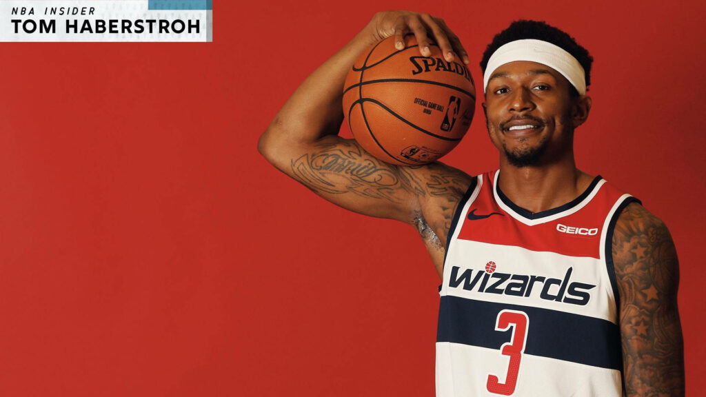 Bradley Beal Washington Wizards basketball player holding ball red background NBA wallpaper
