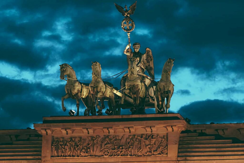 Brandenburg Gate Quadriga silhouette with dark stormy clouds neoclassical sculpture wallpaper