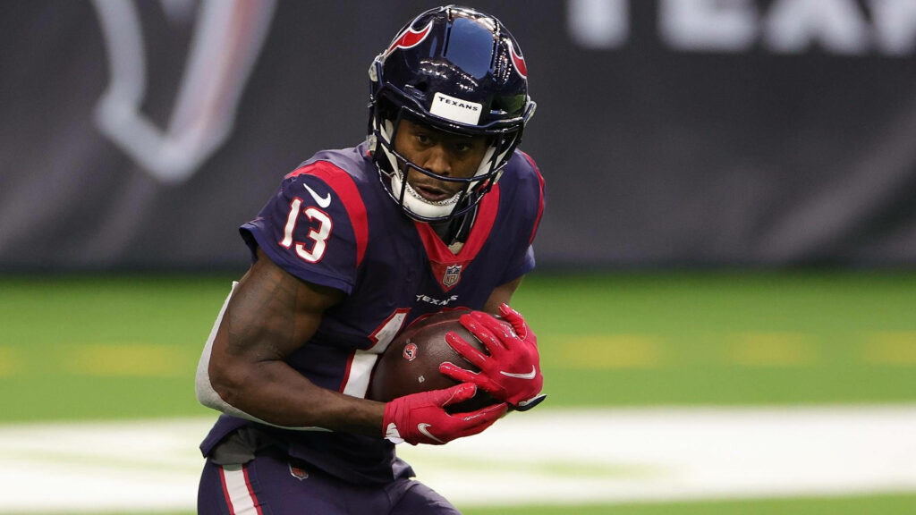 Brandin Cooks in Houston Texans uniform holding football in action vivid team colors wallpaper