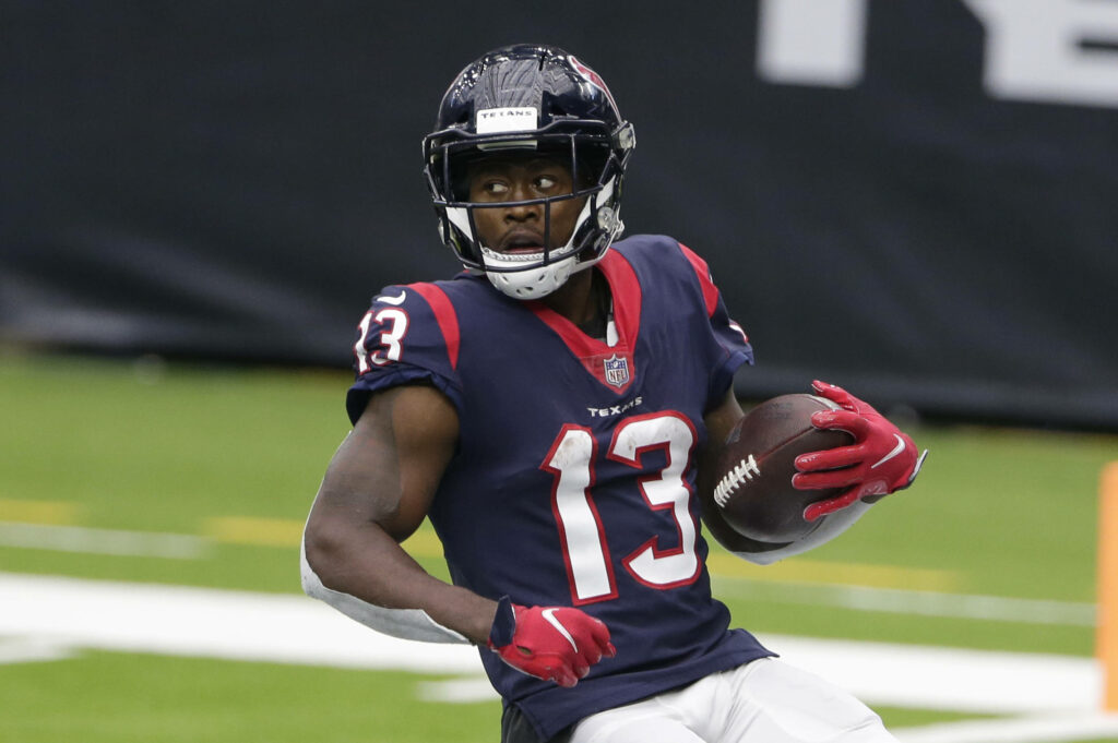 Brandin Cooks Houston Texans wide receiver gripping football in action stadium NFL wallpaper background