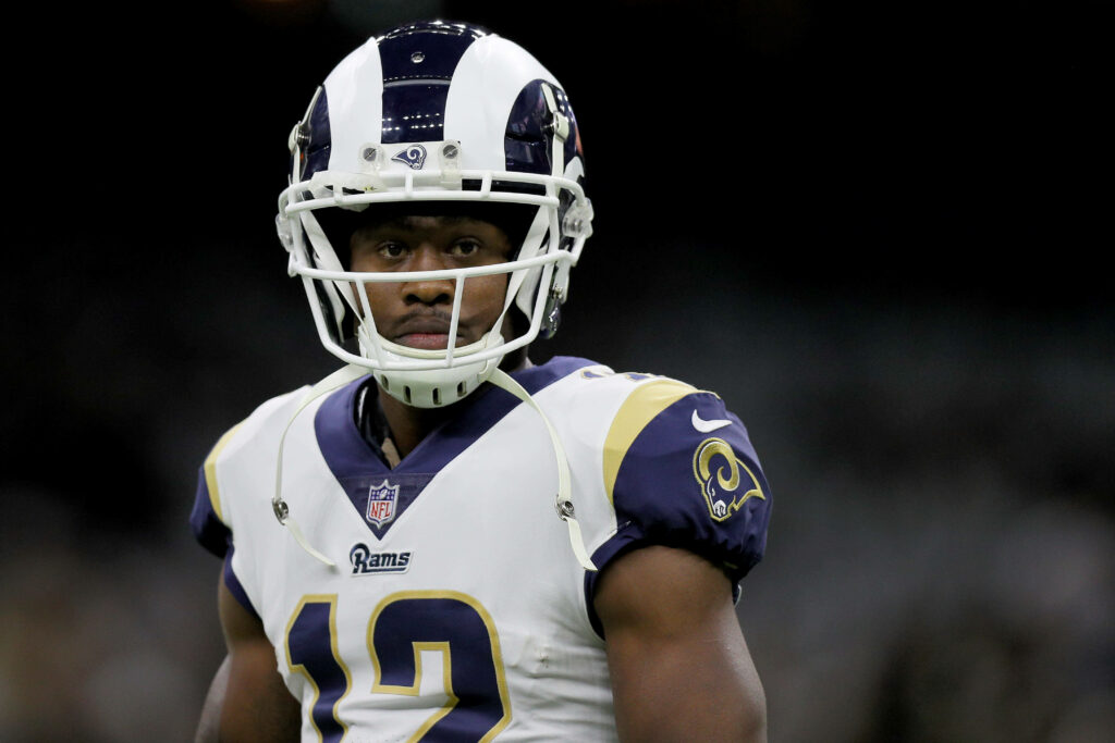 Brandin Cooks in Los Angeles Rams uniform during NFL game showing focus and athleticism Wallpaper
