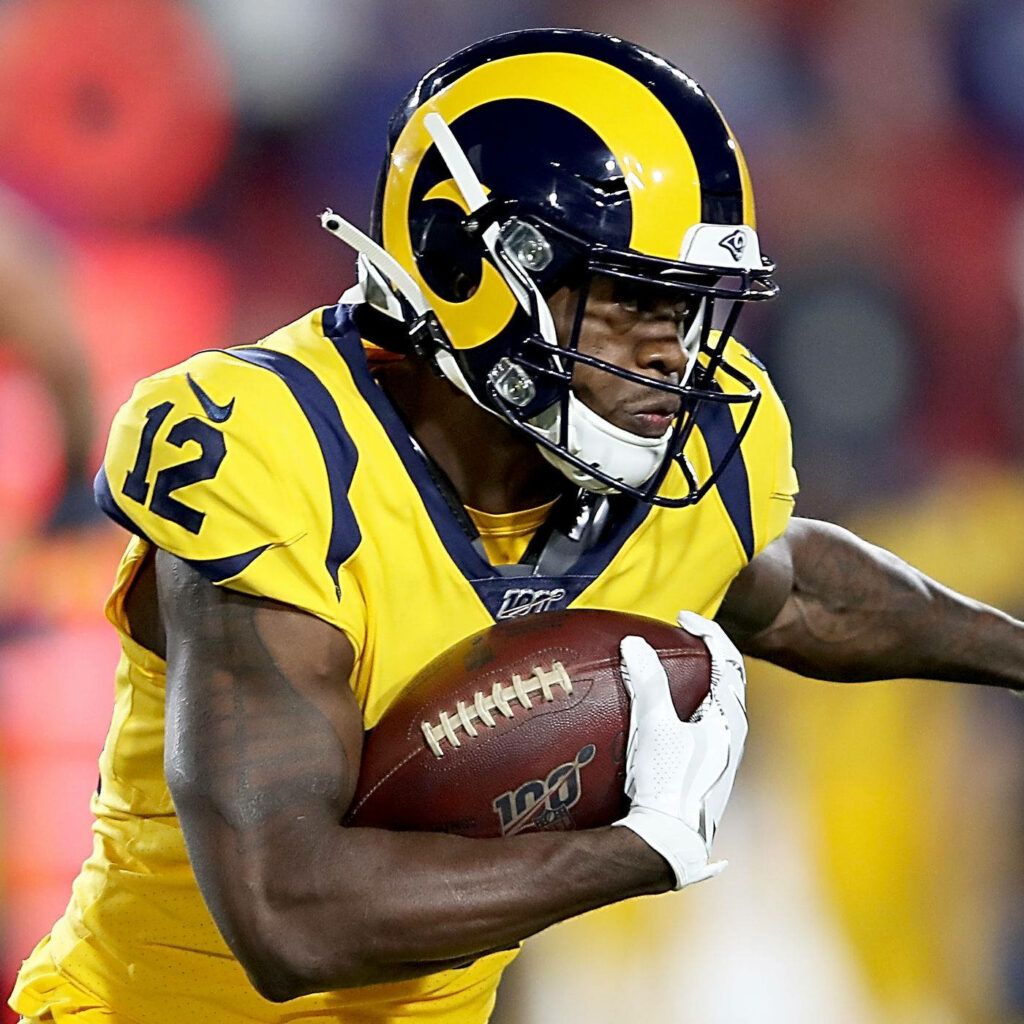 Brandin Cooks in vibrant yellow Los Angeles Rams uniform with blue helmet action wallpaper