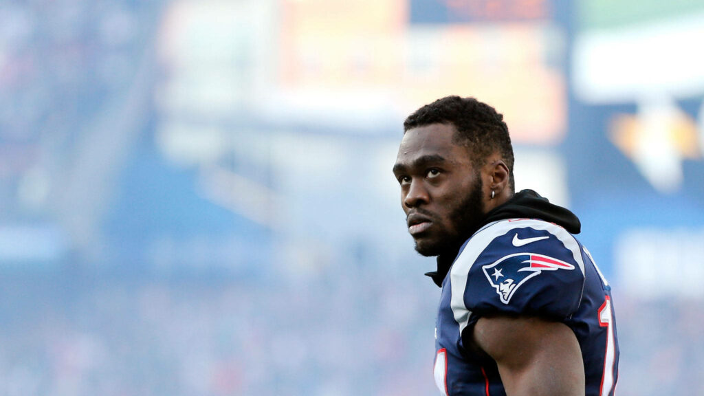 Brandin Cooks in New England Patriots uniform on football field game day with stadium lights Wallpaper
