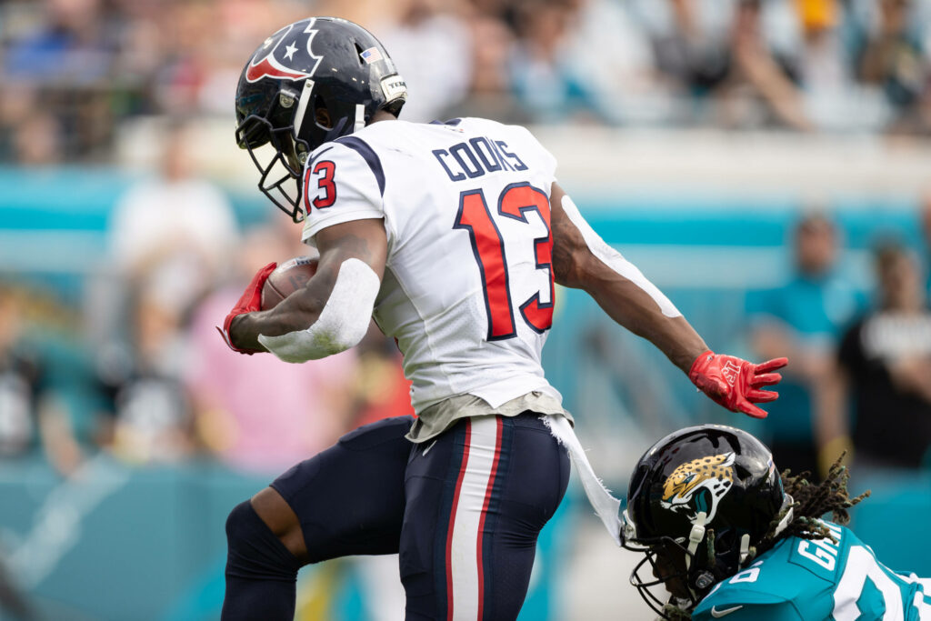 Brandin Cooks sprinting past Jaguars defender dynamic NFL football action Houston Texans wallpaper