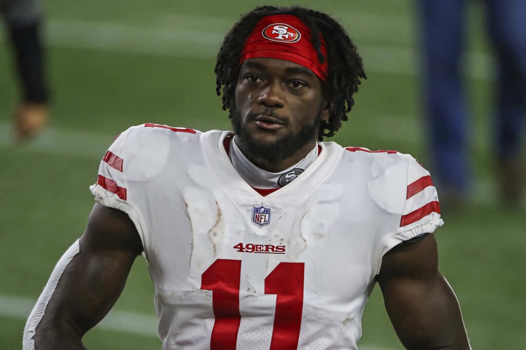 Brandon Aiyuk in San Francisco 49ers uniform intense game day wallpaper NFL wide receiver background