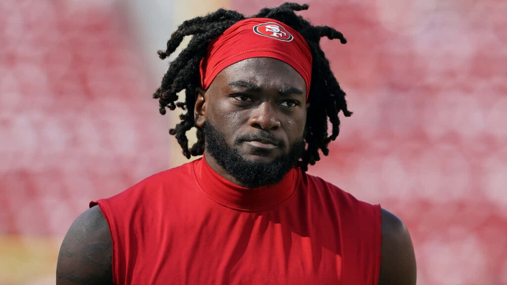 Brandon Aiyuk San Francisco 49ers focused training with red sleeveless shirt and headband wallpaper