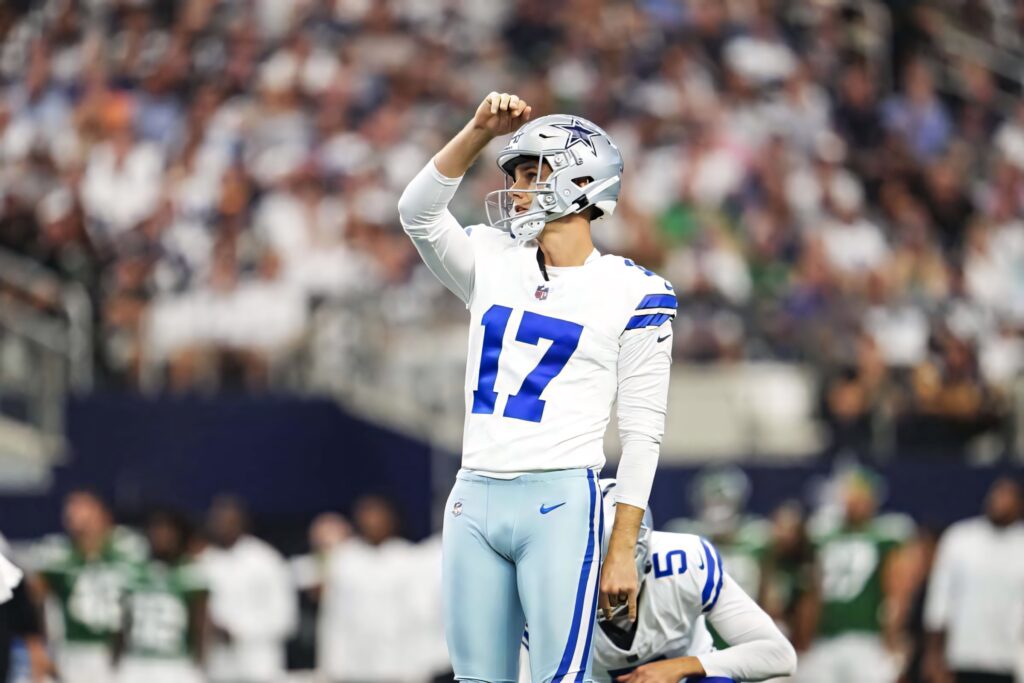 Brandon Aubrey Dallas Cowboys kicker in number 17 jersey focused on field NFL stadium background Wallpaper
