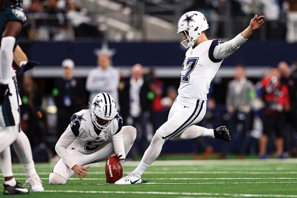 Brandon Aubrey Dallas Cowboys kicker mid field goal attempt vibrant NFL football action wallpaper